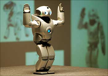 The QRIO robot performs a dance at a New Delhi school.