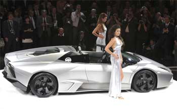 Models pose next to the new Lamborghini Reventon.