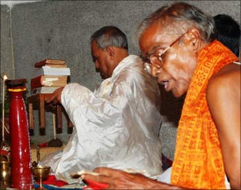 Pranab Mukherjee at the Puja pandal with another priest.