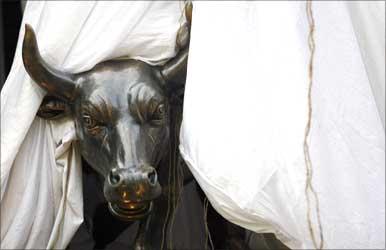 A bronze replica of a bull is seen at the gates of the Bombay Stock Exchange.