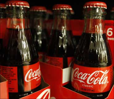 Bottles of Coca-Cola sit on a supermarket shelf in Gilbert, Arizona.