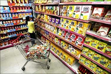 A customer collects food packets at a shopping mall in Siliguri.