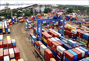 Shipping containers stand stacked at Cochin Port.