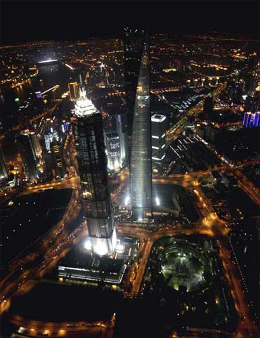 An aerial view of Shanghai's new financial district skyline along the Huang Pu river at night