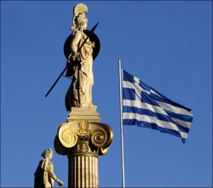 Image: A Greek national flag flutters in the air next to a statue of Athena in Athens. Photograph: Yiorgos Karahalis/Reuters