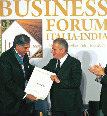 Italy's Economic Development Minister Claudio Scajola (R) confers the Order of Merit of Italian Republic award to Ratan Tata.