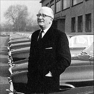 Sir William Lyons in front of the Jaguar factory.