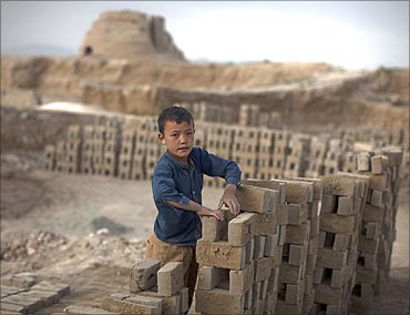 An Afghan boy works at a brick-making factory in Kabul.