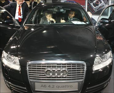 Microsoft founder Bill Gates checking out an Audi A6 4.2 Quattro.