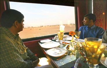 Guests sit inside the Swarna Mahal of the new luxury train, Royal Rajasthan on Wheels.
