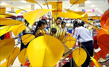 Shoppers check out products at a mall in the commercial hub of Noida in Uttar Pradesh.