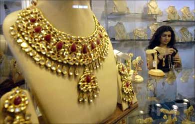 A visitor tries on jewellery.