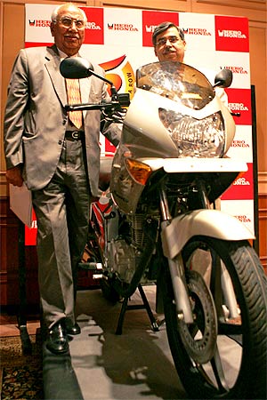 Brijmohan Lall (L), Chairman of India's top motorcycle maker, Hero Honda Motors Ltd. and Managing Director Pawan Kant Munjal