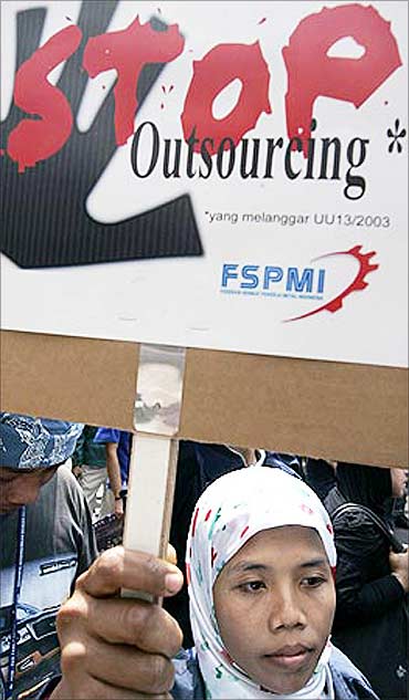 A woman protesting against outsourcing at a rally in front of Japan's embassy in Jakarta.