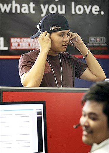 Sitel employees take calls from international customers at its new facility in Pasig City.