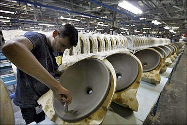 An employee works inside the Duravit production site in Gujarat.