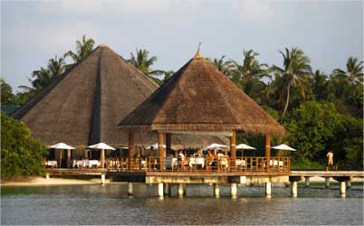 Tourists enjoy their dinner at a restaurant on the island resort of Har Alif Atoll.
