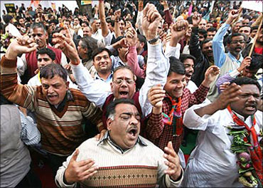 Bharatiya Janata Party activists shout slogans against price rise.