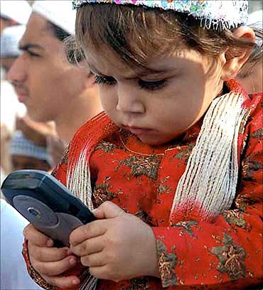 A child playing with a mobile phone.