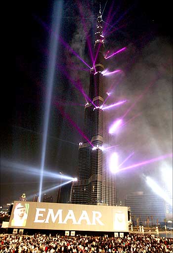 Burj Dubai tower, the world's tallest skyscraper, is lit by laser lights during its opening ceremony in Dubai.