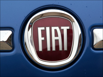 The logo on Fiat 500 vehicle.
