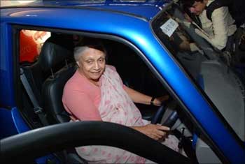 Delhi Chief Minister Sheila Dixit checks out a Reva car.