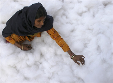 A woman gathers cotton to make a quilt at a workshop in Chandigarh.