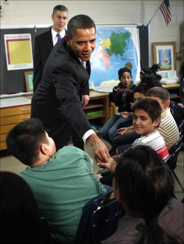 US President Barack Obama greets students at Graham Rd. Elementary School in Falls Church, Virginia.