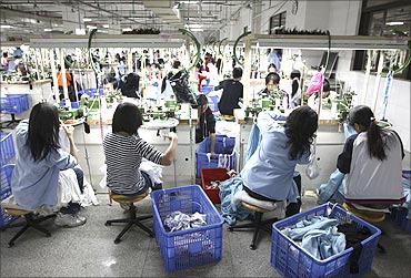 Labourers work at a textile factory in Dongguan, Guangdong province.