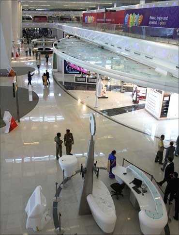 People walk inside the newly constructed Terminal 3 at Indira Gandhi International Airport.