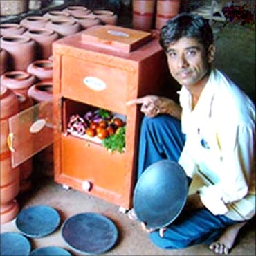 Mansukhbhai Prajapati with his innovation, Mitticool.