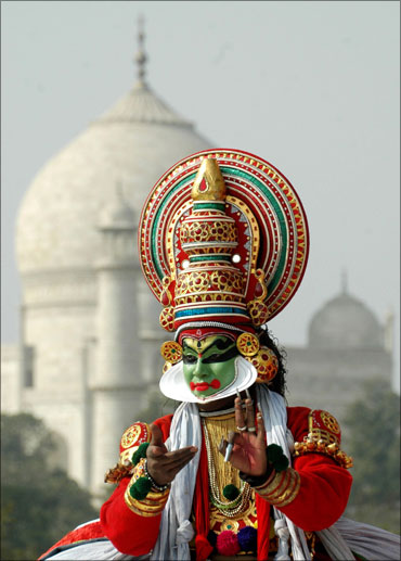 A dancer performs at the rear of the historic Taj Mahal to promote tourism in Agra.