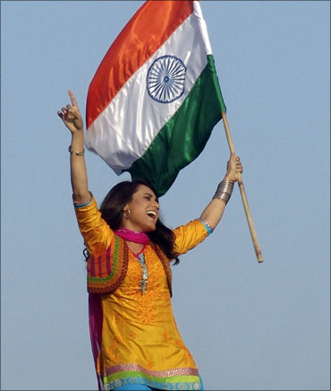 Actress Rani Mukherjee waves the Indian flag.