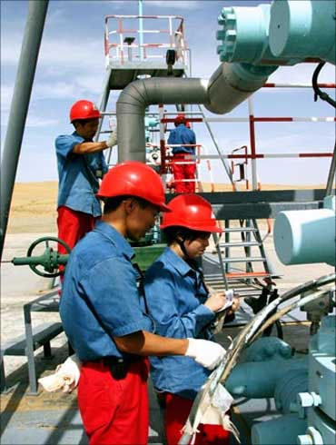 Chinese employees of China National Petroleum Corp. work at Tarim Oil Field.