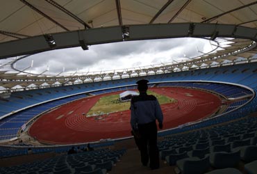 A paramilitary soldier stands guard inside the Jawaharlal Nehru Stadium constructed for the 2010 Commonwealth  in New Delhi.