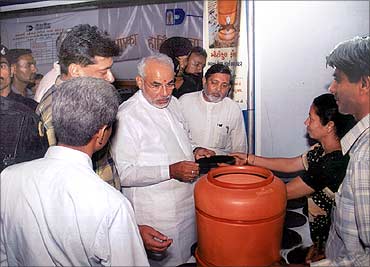 Gujarat Chief Minister Narendra Modi checks the products.
