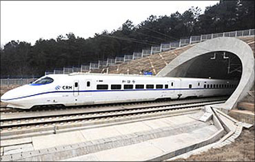 The high-speed train travels on the new Wuhan-Guangzhou railway in Wuhan, Hubei province.