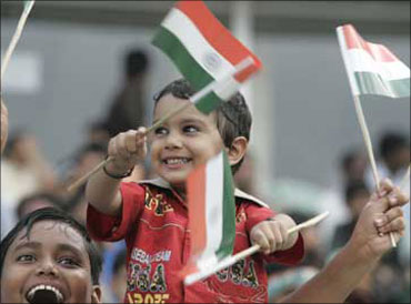 A child waves the Indian national flag.