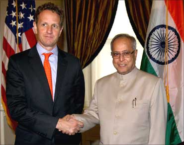 US Secretary of Treasury, Tim Geithner shakes hand with Pranab Mukherjee.