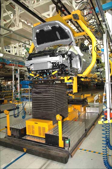 Engine being fitted to a car at the Ford plant in Chennai.