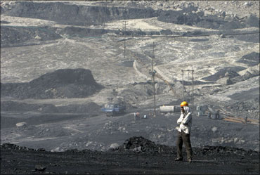 A miner stands at the Gevra coalmines in Chhattisgarh.