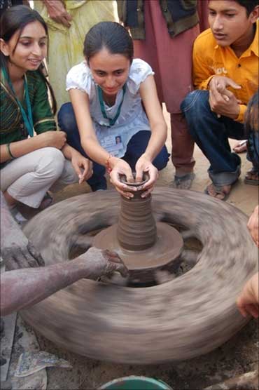 IIM students try their hand at pottery.