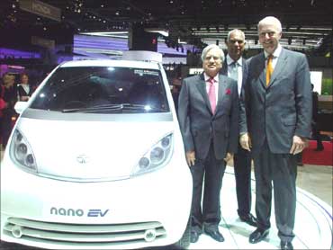 Tata Motors officials with Tata Indica Vista Electric at the Delhi Auto Expo 2010.