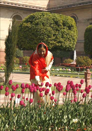 President Pratibha Patil touches a display of tulips inside the famous Mughal Garden.