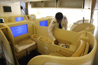 An official looks at the first class cabin section in Air India's Boeing 777-200 LR aircraft.