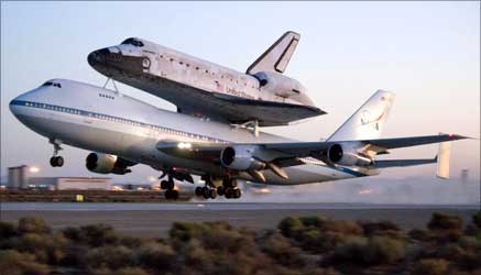 NASA's Space shuttle Discovery, atop a modified 747 carrier aircraft lift off from Edwards Air Force Base, California, en route to the Kennedy Space Center in Florida.