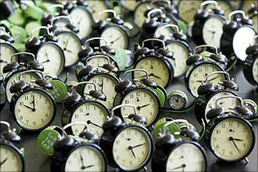 Clocks are seen during the performance - tck tck tck -- by Global Campaign for Climate Action.