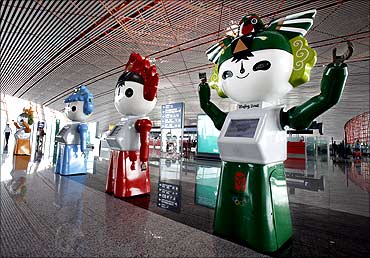 Olympic 'Fuwa' mascots parade at the new Beijing Capital International Airport July 23, 2008.