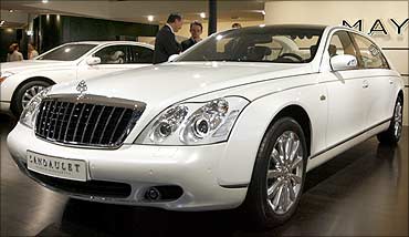 A Maybach 62 S Landaulet limousine is displayed at a car show.