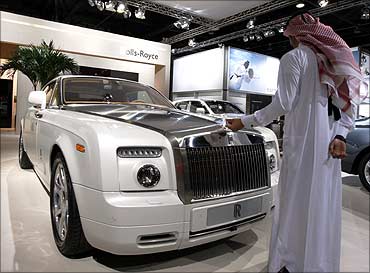 Visitors look at the Rolls Royce Phantom during Dubai Motor Show.
